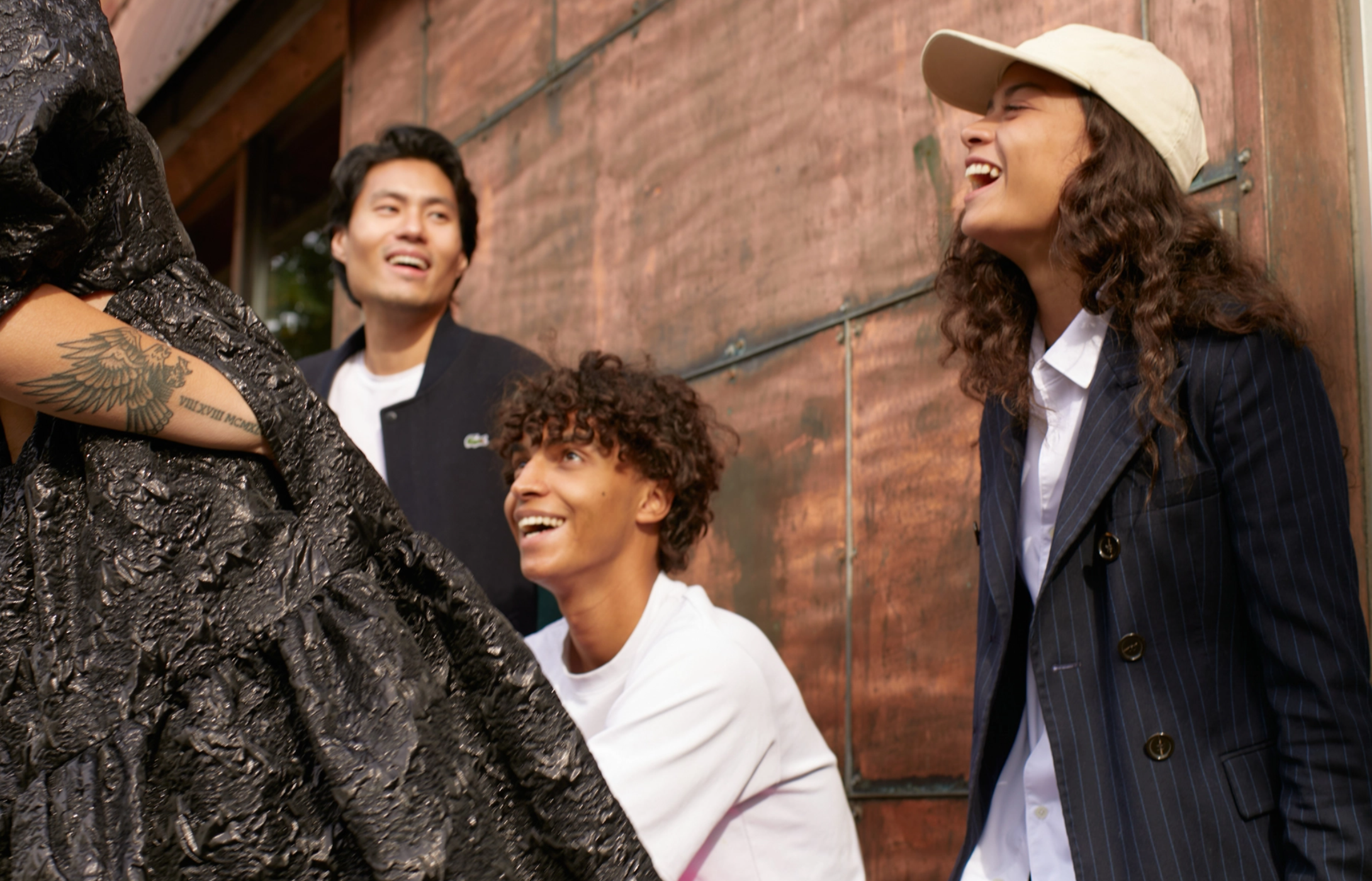 group of four people laughing